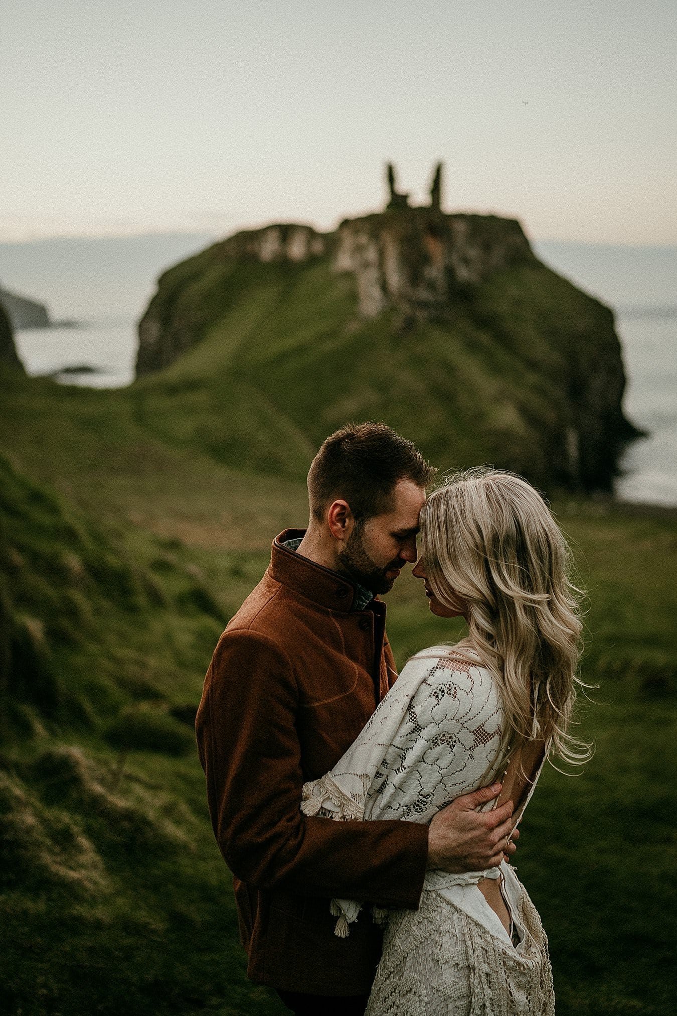 A sunset portrait in beautiful light on the Causeway Coast. Romantic adventure elopements in Europe. 