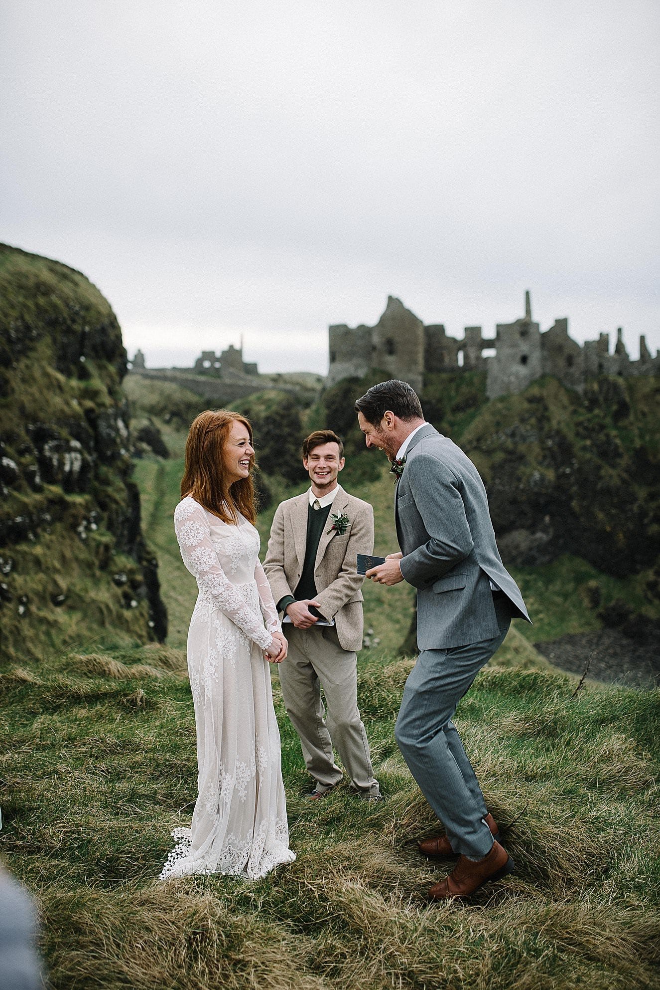 Joyful moments during an elopement ceremony at Dunluce Castle in Northern Ireland 