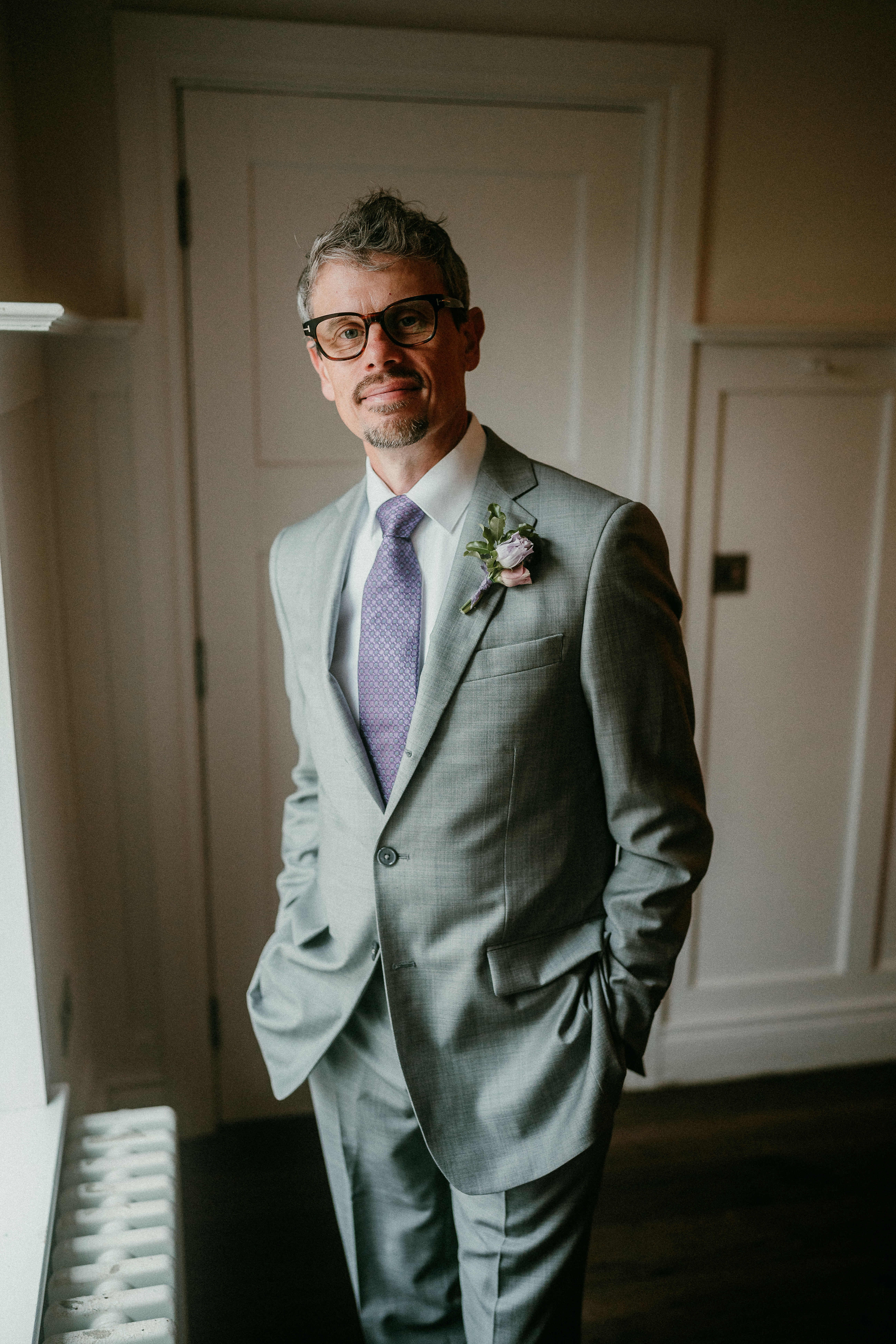 The groom in his suit for outdoor elopement in Ireland